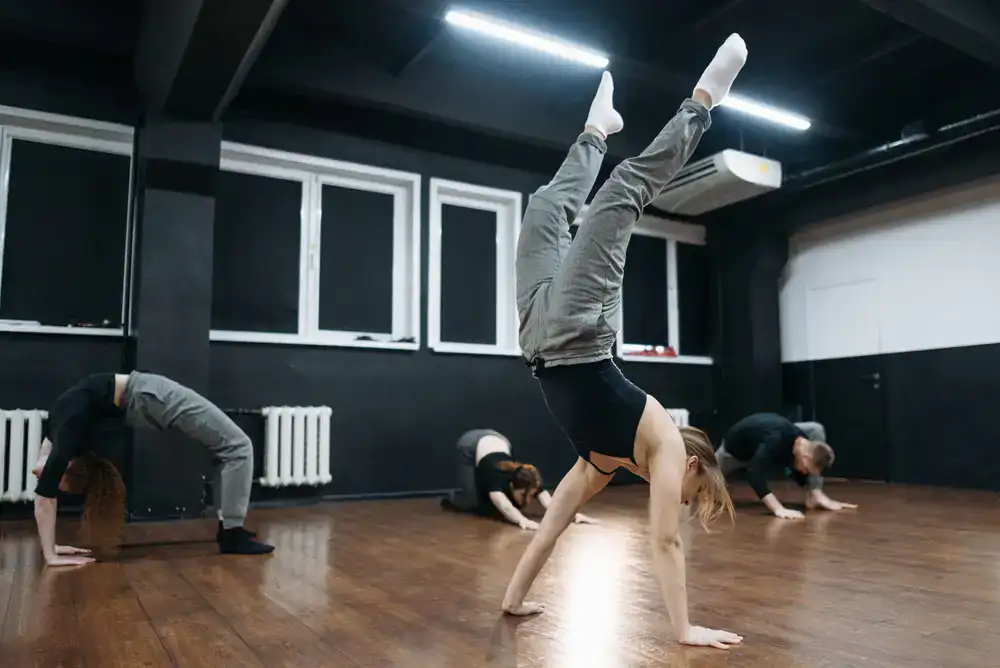 Students practicing floor acrobatics