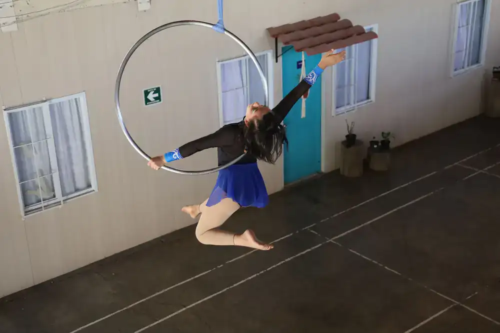 Students practicing aerial hoop skills