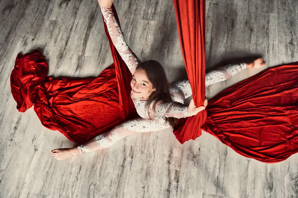Aerial artist performing elegantly on silks