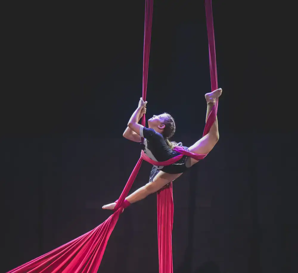 Student performing on aerial silks