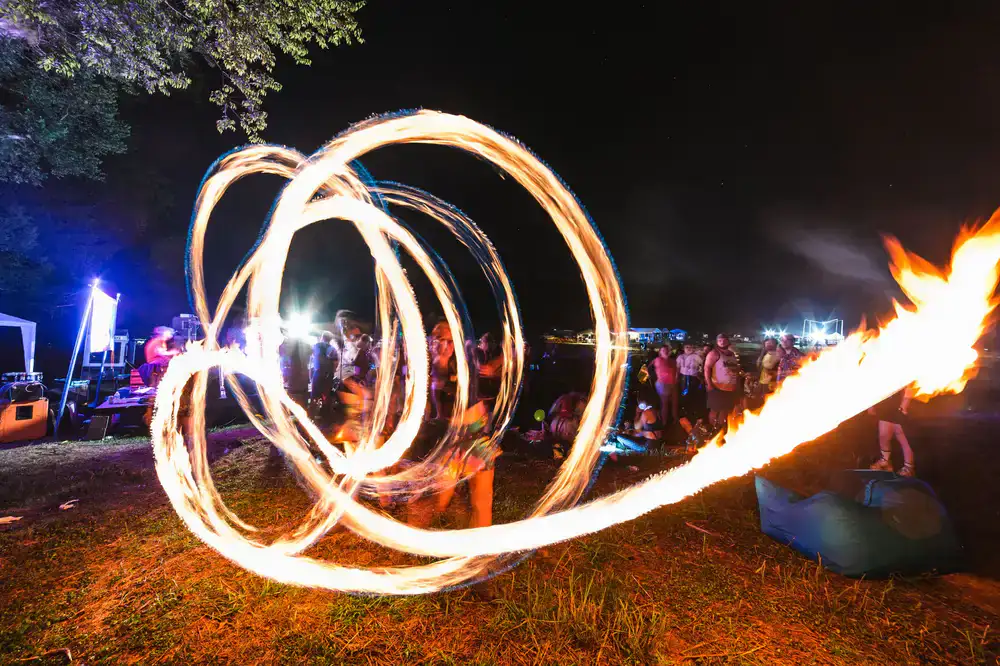 Fire spinners at an outdoor festival